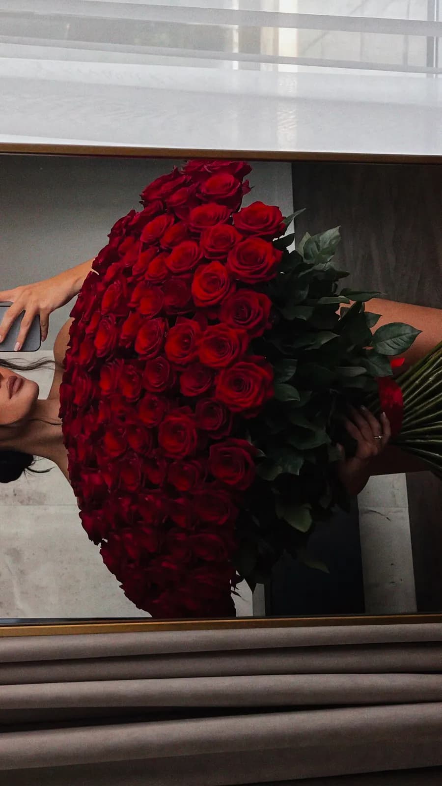 Giant rose bouquet mirror selfie — example 2