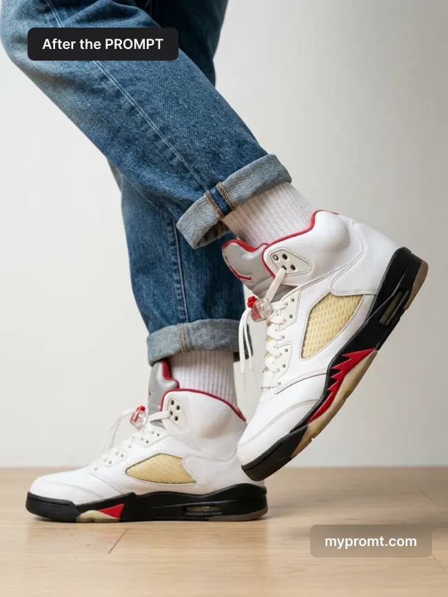 White and red sneaker worn with cuffed blue denim on a light wood floor against an off-white wall